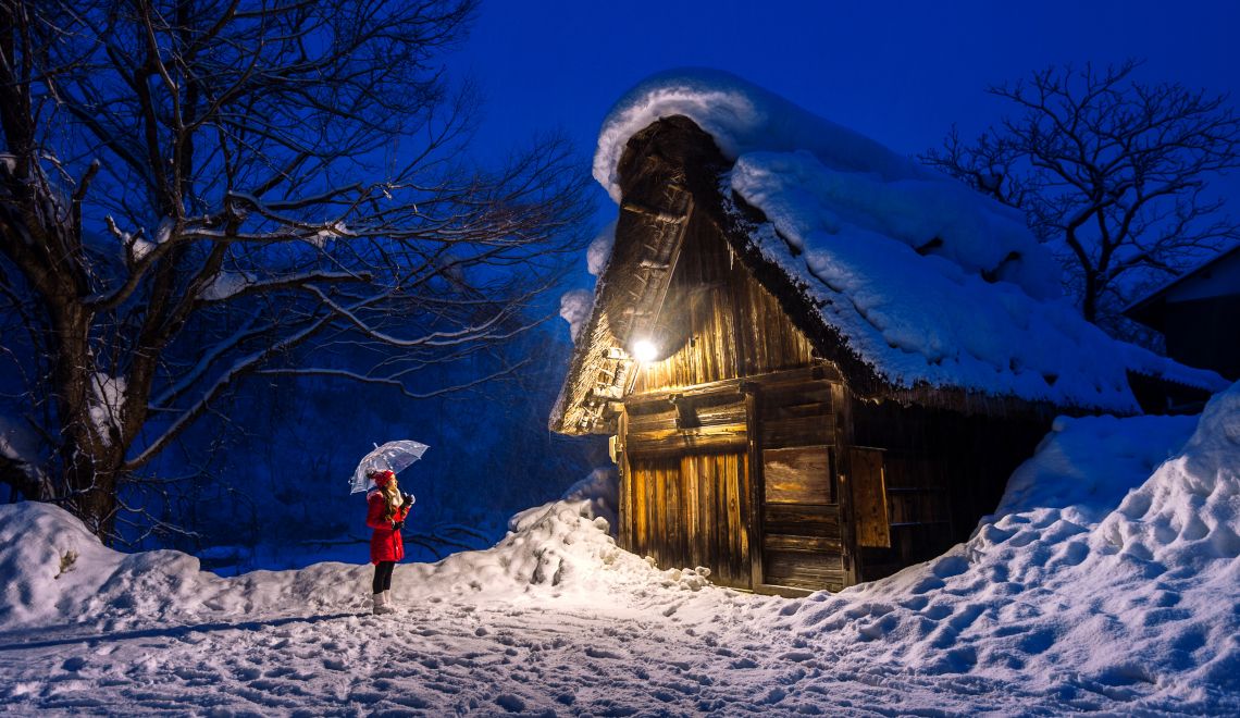 Young woman in Shirakawa-go village in winter, UNESCO world heri